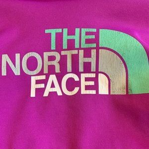 A purple Northface sweatshirt